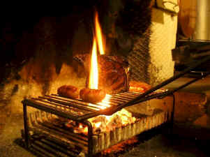 grilling a steak in a Tuscan kitchen